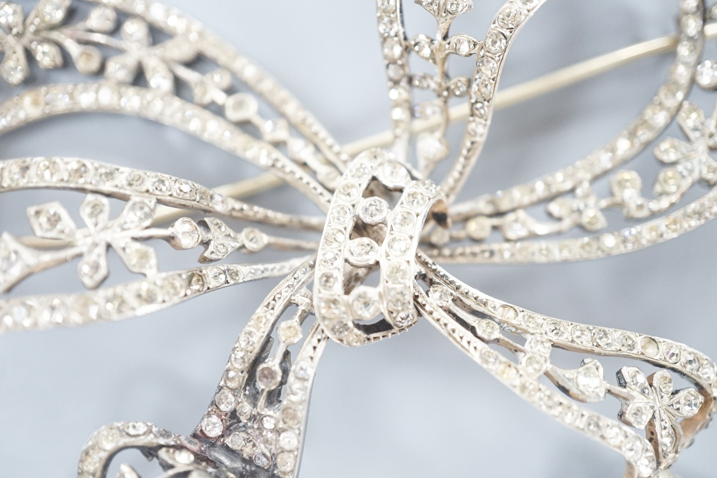 A sterling and paste set large ribbon bow brooch, width 95mm.